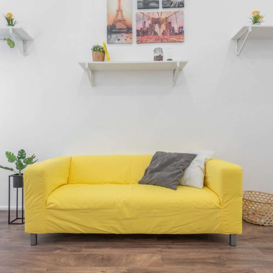 yellow fabric sofa inside a living room