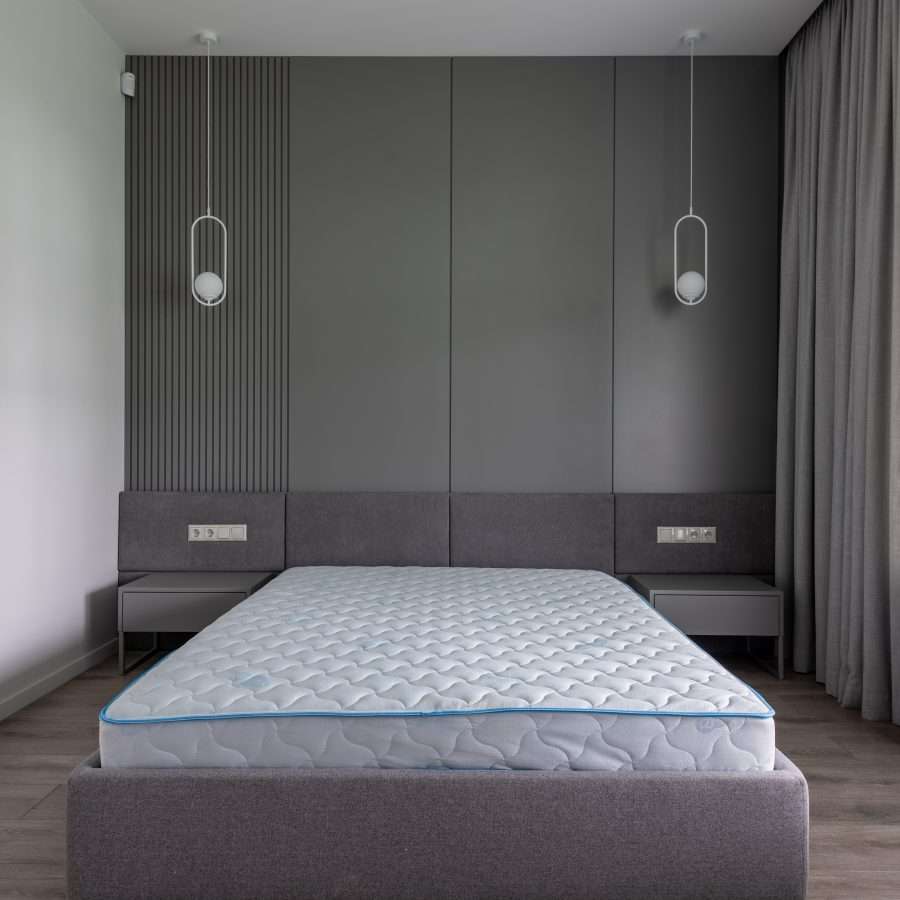  Bed with soft orthopaedic mattress in a bedroom