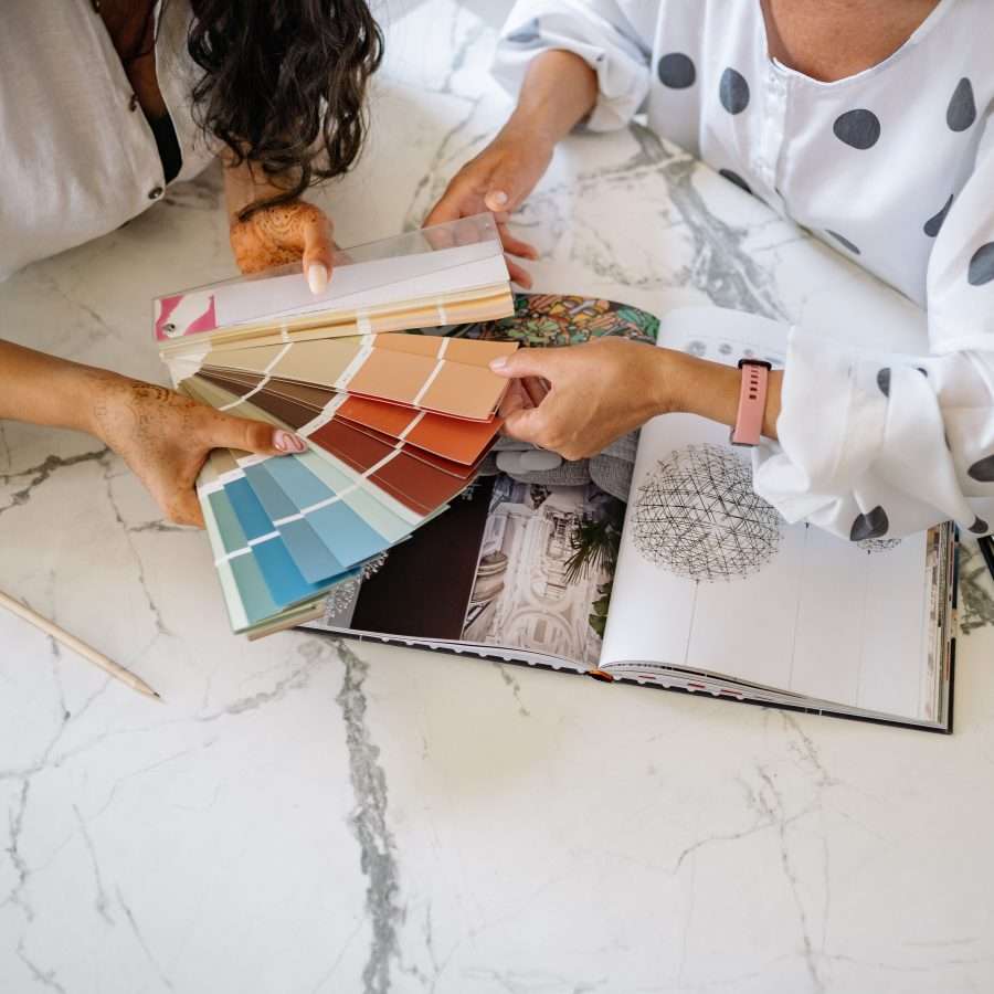  Women Holding a Sample Color Chart