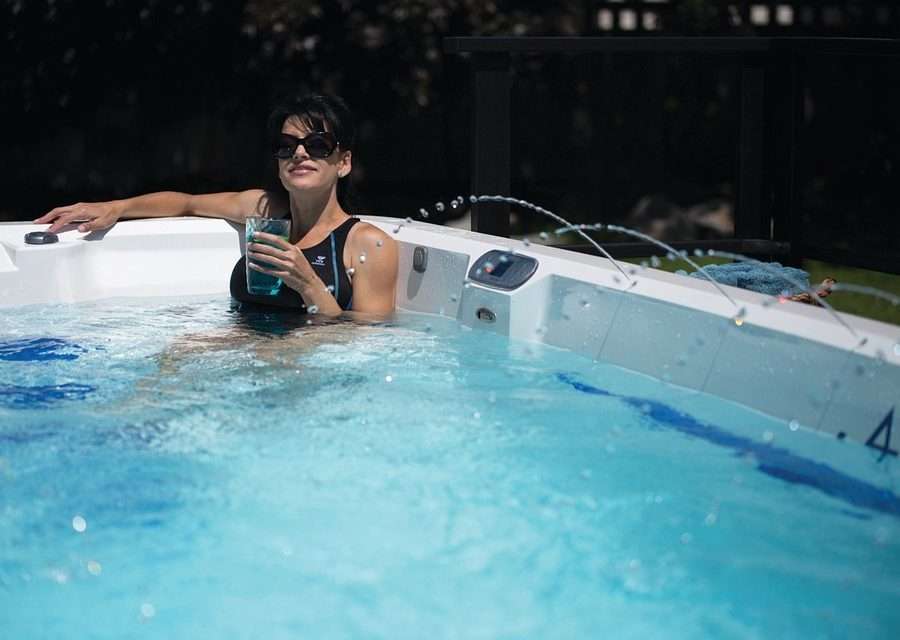 a woman enjoying a vacation in a hot tub