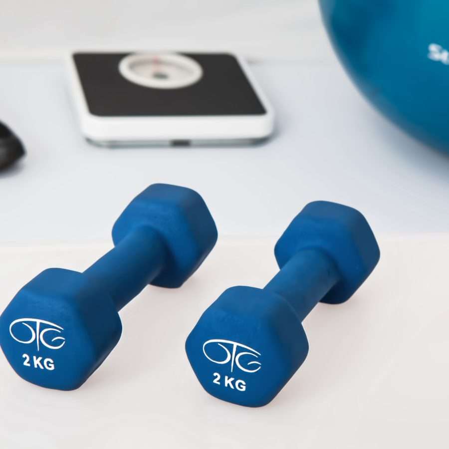 Two 2 Kg. Blue Hex Dumbbells on White Surface